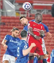  ??  ?? Liverpool's Senegalese striker Sadio Mane (R) vies with Everton's English striker Dominic Calvert-Lewin (L) and Everton's English midfielder Ben Godfrey (C) during the match