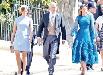  ??  ?? Prince Andrew and his daughters Princess Eugenie (left) and Princess Beatrice arrive for the wedding ceremony of Prince Harry and Meghan Markle at St George’s Chapel, Windsor Castle, in Windsor, in May. — AFP file photo