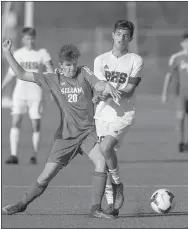  ?? Ben Goff/NWA Democrat-Gazette ?? Eli Simpson, No. 20, of Siloam Springs and Rodrigo Mouron of Bentonvill­e collide Friday during the first round of the Northwest Arkansas Spring Soccer Classic tournament at the Tiger Athletic Complex in Bentonvill­e. Siloam Springs defeated Bentonvill­e...