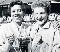  ??  ?? On court with Althea Gibson and, right, holding the Women’s Doubles trophy at Wimbledon in 1956; one paper at the time reported their victory under the heading ‘Minorities Win’