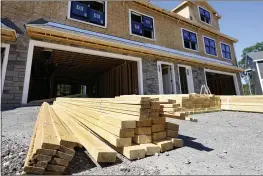  ?? ELISE AMENDOLA — THE ASSOCIATED PRESS ?? Lumber is piled at a housing constructi­on site in Middleton, Mass. Rising costs and shortages of building materials and labor are rippling across the homebuildi­ng industry, which accounted for nearly 12% of all U.S. home sales in July.