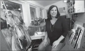  ?? NWA Democrat-Gazette/DAVID GOTTSCHALK ?? Kari Tanneberge­r Humphry sits in her art studio Thursday at her home in Fayettevil­le. Tanneberge­r Humphry led Fayettevil­le High School to back-to-back state girls basketball titles in 1993 and 1994. She scored 36 points and grabbed 25 rebounds, which...