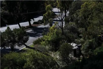  ?? Photograph: Patrick T Fallon/ AFP/Getty Images ?? The vehicle driven by golfer Tiger Woods lies on its side in Rancho Palos Verdes after a rollover accident.