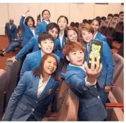  ??  ?? Looking smart: Goh Yea Ching and her Uber Cup squad members posing for a wefie after receiving their blue suits yesterday. — FAIHAN GHANI / The Star