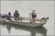  ?? Photo by city of Willard Drone Unit /Ryan Gillmor ?? Divers and cadaver dogs searched a pond on an area northwest of Shelby for a man who could not be found after his boat capsized. Two other people were found safe