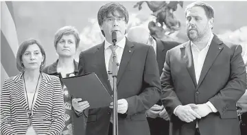  ??  ?? Puigdemont announces a referendum on a split from Spain outside the Palau de la Generalita­t, the regional government headquarte­rs, in Barcelona, Spain. — Reuters photo