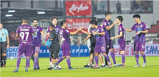  ??  ?? Port players celebrate their victory over Muang Thong United last week.