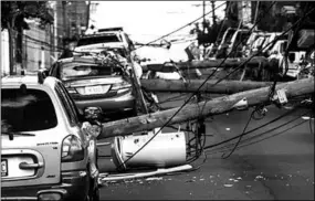  ??  ?? Downed power lines in the street after Tropical Storm Isaias and its treacherou­s winds and heavy rain passed through on August 4 in Guttenberg, New Jersey. (Photo: CNN)