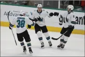  ?? MICHAEL AINSWORTH — THE ASSOCIATED PRESS ?? San Jose Sharks right wing Timo Meier (28) is congratula­ted on his goal against the Dallas Stars by defensemen Mario Ferraro (38) and Ryan Merkley (6) during the second period of an NHL hockey game in Dallas, Saturday.