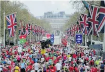  ?? TOM HEVEZI/ THE ASSOCIATED PRESS FILES ?? Competitor­s make their way from the finish area at the London 2010 Marathon. Determined to show solidarity for Boston, London Marathon organizers will stage the race on Sunday.