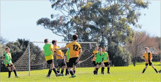  ??  ?? Dannevirke Junior Football Reps attempt to convert a corner kick into a goal in Feilding on August 12.