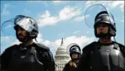  ?? KENT NISHIMURA/LOS ANGELES TIMES/TNS ?? U.S. Capitol Police officers, in full gear in anticipati­on of possible violence at a small right-wing rally Sept. 18, were backed up by local law enforcemen­t officers and the National Guard.