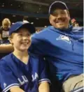  ?? BRENDAN KENNEDY/TORONTO STAR ?? Ryan Pelton, 8, and dad Mike take in the Jays’ final game Wednesday night.