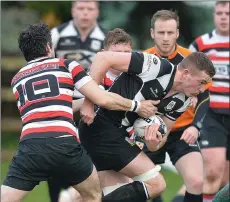  ??  ?? Ivan Poole tries to halt the progress of Dundalk’s John Smith.