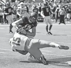  ?? TIM VIZER/UWF ATHLETICS ?? University of West Florida defensive lineman Aidan Swett (15) sacks McKendree University quarterbac­k Caleb Fisher (12) during the Argos' 35-3 win over the Bearcats on Sept. 9.