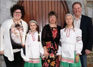  ?? Photo by Michelle Cooper Galvin ?? Alien Lusevich and Aryna Kananiuk from Chernobyl with their hosts Jim, Eileen and Nora O’Sullivan, Rathcoole, of The Friends of the Children of Chernobyl Rathmore Branch at the 21st Anniversar­y Mass in Rathmore Church on Wednesday.