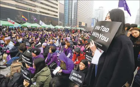  ?? Ahn Young-joon Associated Press ?? WOMEN GATHER in Seoul in March 2018 to mark Internatio­nal Women’s Day. Antipathy toward feminism has been gaining broadbased support in South Korea, where a poll found more than 65% of men in their 20s said they equated feminism with a hatred of men.