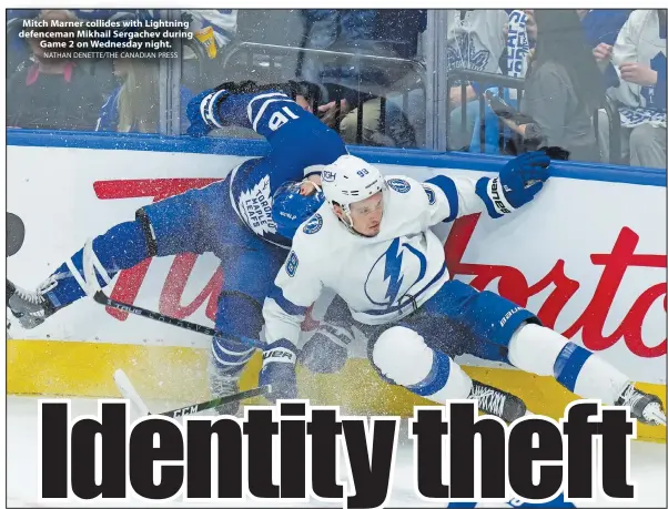  ?? NATHAN DENETTE/THE CANADIAN PRESS ?? Mitch Marner collides with Lightning defenceman Mikhail Sergachev during Game 2 on Wednesday night.