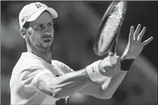  ?? EDUARDO MUNOZ ALVAREZ/AP PHOTO ?? Novak Djokovic returns the ball on Saturday as he practices for the U.S. Open at New York.