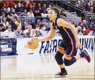  ?? Icon Sportswire via Getty Images ?? UConn’s Azzi Fudd drives to the basket against NC State during an Elite Eight game March 28. After missing two months with a foot injury, Fudd played in UConn’s final 20 games of the season, starting 17 of them.