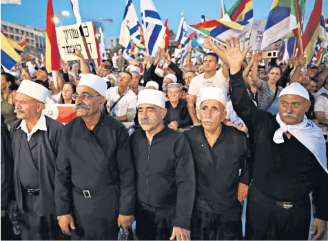  ??  ?? Druze leaders head a demonstrat­ion in Rabin Square, Tel Aviv, on Saturday