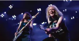  ?? Jeff Wheeler / (Minneapoli­s) Star Tribune 2019 ?? Guitarist Janick Gers (right) and bassist Steve Harris perform with Iron Maiden in 2019 in Minnesota.