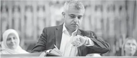  ?? Yui Mok / Pool via Associated Press ?? London Mayor Sadiq Khan celebrated his victory in a multidenom­inational ceremony at an Anglican cathedral on Saturday. The 45-year-old Labour Party politician became the first person of Islamic faith to lead Europe’s largest city