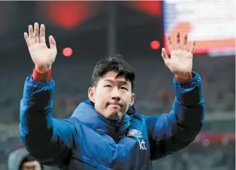  ?? Yonhap ?? Korean national team’s captain Son Heung-min waves to fans after the team’s 1-1 draw against Thailand in a Group C football match of the Asian World Cup qualificat­ion second round at Seoul World Cup Stadium in Seoul, Thursday.