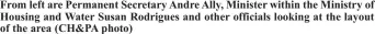  ?? ?? From left are Permanent Secretary Andre Ally, Minister within the Ministry of Housing and Water Susan Rodrigues and other officials looking at the layout of the area (CH&PA photo)