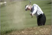  ?? LAURENT CIPRIANI — THE ASSOCIATED PRESS ?? Brooke Henderson, of Canada, follows her ball after playing on the fifth hole during the last round of the Evian Championsh­ip in Evian, eastern France, on Sunday.