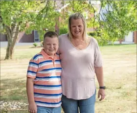  ?? Andrew Rush/Post-Gazette ?? Jennifer Tomko, of North Huntingdon, and her son Michael, 9, a fourth grader in the Norwin School District, are getting ready for the new school year.