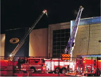  ?? AL CHAREST ?? Fire crews were on the scene of a large fire at the newly-completed Cineplex Seton and VIP Cinema in southeast Calgary Sunday. The fire occurred just weeks before the cinema was set to open its doors.