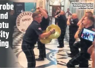  ??  ?? The Govan Protestant Boys flute band plays The Sash
in Belfast City Hall