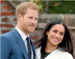  ??  ?? Prince Harry and Meghan Markle during an official photocall to announce their engagement at The Sunken Gardens at Kensington Palace.