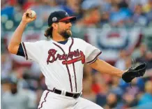  ?? THE ASSOCIATED PRESS ?? Pitcher R.A. Dickey, who had a 10-10 record last season in 31 starts with the Atlanta Braves, will be the featured speaker Tuesday night at the FCA’s annual Road to Victory Banquet at the Catoosa County Colonnade. Dickey is not currently signed with a...