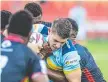  ?? Picture: Kevin Farmer ?? WRAPPED UP: Norths Devils Jacob Gagan takes on the PNG Hunters’ line during the Hostplus Cup clash at Toowoomba’s Clive Berghofer Stadium. The Devils are set to play a game in Roma as part of the Activate Queensland! Country Week initiative.