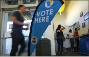  ?? RINGO H.W. CHIU — THE ASSOCIATED PRESS FILE ?? Voters wait in line to cast their ballot on Super Tuesday at a voting center in El Segundo.