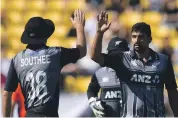  ?? AFP ?? New Zealand’s Ish Sodhi, right, took two wickets against England in Wellington