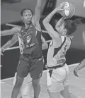  ?? AP ?? The Liberty's Kia Nurse (5) shoots against the Mercury's Shatori Walker-Kimbrough on Sept. 5 in Bradenton, Fla.