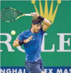  ?? — AFP ?? Rafael Nadal of Spain hits a return during his third round match against Fabio Fognini of Italy at the Shanghai Masters in Shanghai, China.