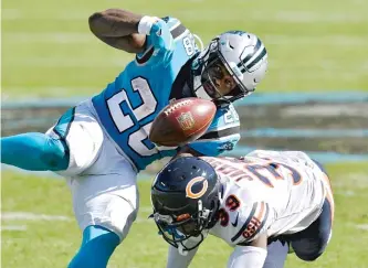  ?? GETTY IMAGES ?? Safety Eddie Jackson forces Panthers running back Mike Davis to fumble in the third quarter.