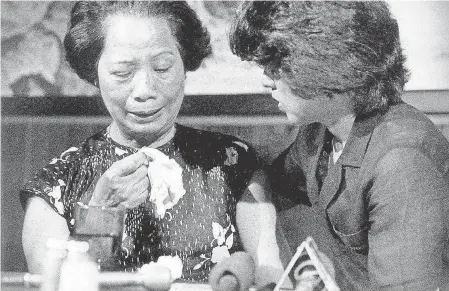  ??  ?? Zia comforts Lily Chin, the mother of Vincent Chin, who was killed because of his race, during a news conference in 1984. Zia fought for justice for Vincent Chin, mobilizing an Asian American rights movement. PAULINE LUBENS/ DETROIT FREE PRESS