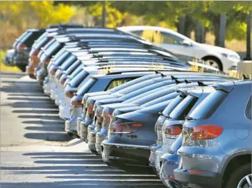  ?? Brennan Linsley Associated Press ?? VW DEALERSHIP­S like this one in Boulder, Colo., will receive about $1.85 million as part of a settlement with the company. The money is compensati­on for sales lost due to the emissions cheating scandal.
