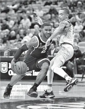  ?? AP Photo/L.G. Patterson ?? ■ Texas A&amp;M’s TJ Starks, left, dribbles past Missouri’s Xavier Pinson, right, during the second half of an NCAA college basketball game Saturday in Columbia, Mo. Texas A&amp;M won, 68-59.