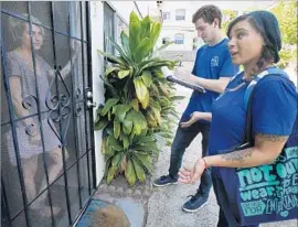  ?? Mel Melcon Los Angeles Times ?? SCOTT TRIPAMER and Diana Mendoza, right, talk to Echo Park resident Shannon Ashcraft about spaying and neutering pets as part of a PETA campaign.