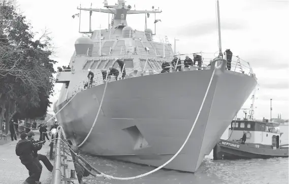  ?? PHOTOS: DAN JANISSE ?? The USS Detroit docks at Dieppe Park in Windsor on Monday. “It’s highly manoeuvrab­le, highly capable — and it’s awfully fun to drive,” Cmdr. Michael Desmond said.