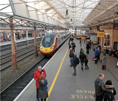  ?? PAUL SHANNON. ?? A Virgin West Coast Class 390 Pendolino arrives at Crewe’s Platform 6 on February 2, forming the 1543 service to Liverpool Lime Street. Government has confirmed that Platform 5 (opposite) will be extended to 400 metres to enable HS2 services to split...