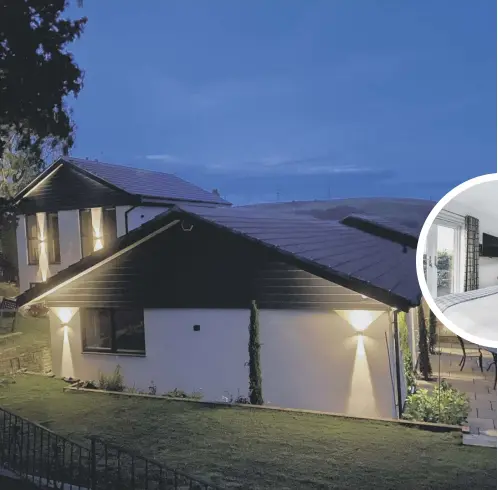  ?? ?? IMPRESSIVE: Outdoor lighting creates a spectacula­r vision at night. The property has a full security system too.