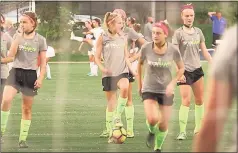  ?? Contribute­d photo ?? Soccer players with Seton High School in Cincinnati wear the Q-Collar in warmups for a 2018 match.