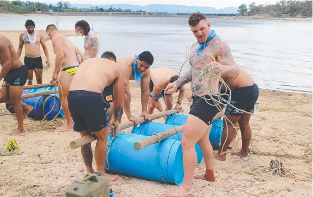  ?? Picture: SUPPLIED ?? COMPETITIO­N: North Queensland Cowboys players, including new recruit Josh McGuire (front), undertake a raft building exercise at Lake Tinaroo.